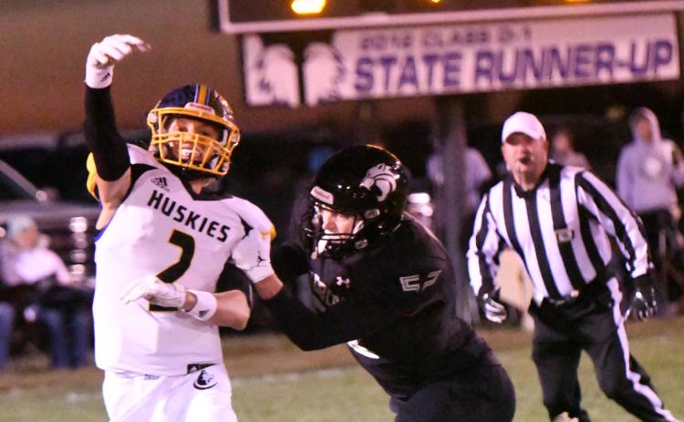 Logan Lindsley passes as a Bobcat defender is ready to tackle. PCN photo by Rick Holtz.