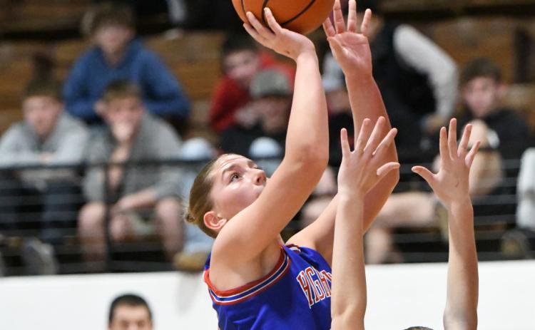 Courtney Carlstrom takes one to the basket. PCN photo by Rick Holtz.