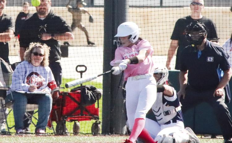 Polk County/Aquinas’ Chloe Schott doubles in a run during the Slammers 8-6 win over Raymond Central in Lincoln. PCN photo by Ken Kush.
