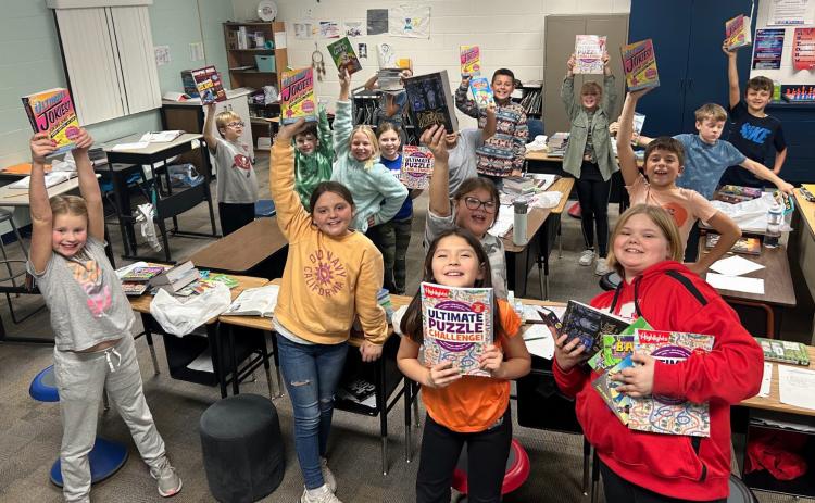 Because of several generous donors, the High Plains Community School was able to raise $13,100 for the Book Blast. This money will go directly to the students to build their home libraries. Above and Below: High Plains Elementary students proudly display their new books.