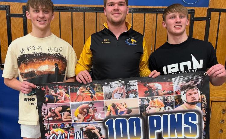 Right: Collin Vrbka (center) achieved his 100th pin of his career at the duals at Tri-County (DeWitt). He is pictured with cousins Jett Vrbka (left) and Coy Vrbka (right). PCN photo by Jen Vrbka.