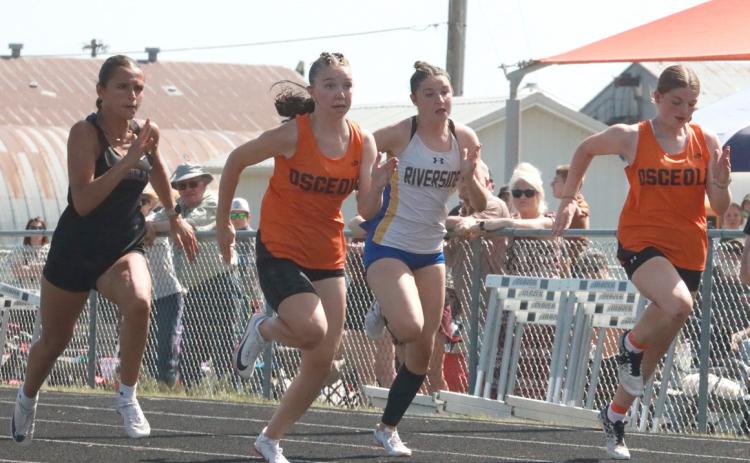 The finals of the girls 100 meters was won by Natalie Laubers (far left) with Osceola’s Camryn Peterson (next to her) taking second. Also pictured is Riverside’s Ella Molt and Osceola’s Jadelynn Gifford (far right). Laubers and Peterson both qualified for state. PCN photo by Ken Kush.