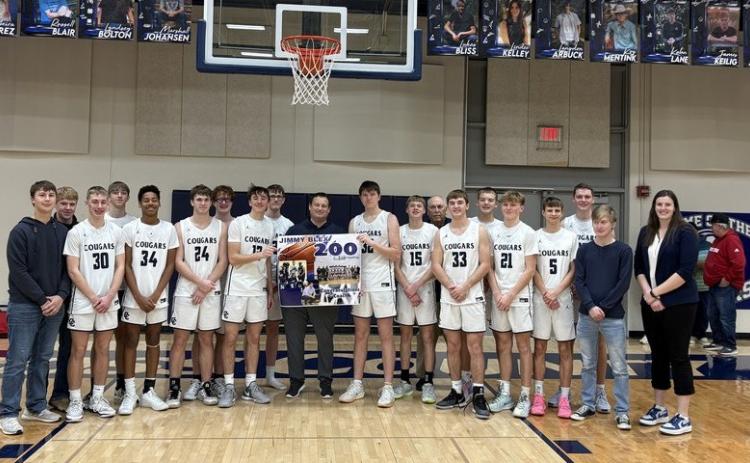 Above: Coach Jimmy Blex of the Cross County Cougars achieved his 200th win last Thursday night against Sutton. He is pictured with the current boys’ basketball team. Photo provided by CC School.