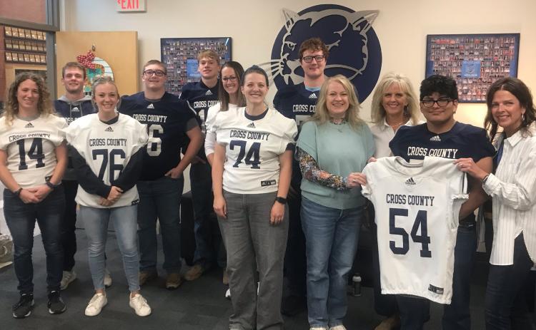 The Cross County senior football players picked a staff member to wear their white jersey who has made an impact on them during their time at school. Pictured is Mrs. Jackman with Cole Redden, Mrs. Kuhnel with Jacob Smith, Mrs. Schroetlin with Sawyer Anderson, Mrs. Hubel with Cannen Mooney, and the secretarial staff of Angie Hild, Kari Baker and Lynn Folts with Joaquin Alvarez Rodriguez. Photo provided.