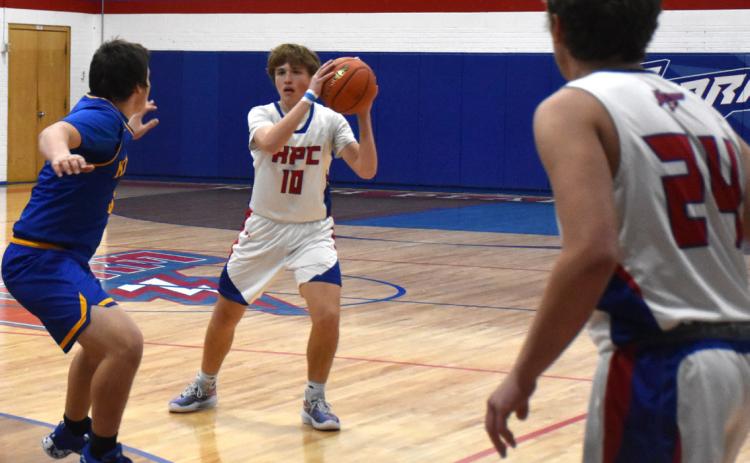 Chase Owens looks to pass to Ayden Hans against Nebraska Lutheran. PCN file photo by Beth Sparrow.