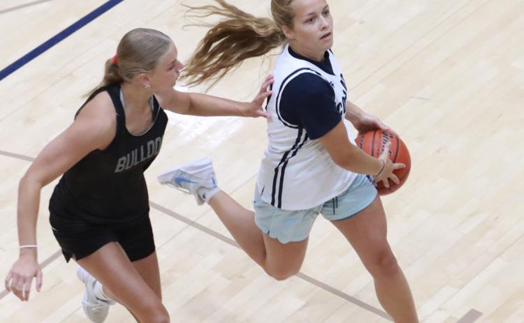 Olive Peterson drives to the basket against the Humphrey-Lindsay defense on Thursday. Peterson is the team’s leading returning scored at 6.7 points per game. PCN photos by Ken Kush