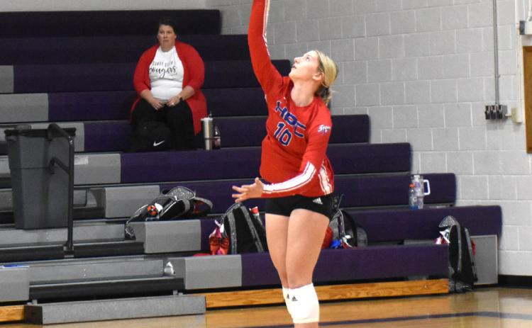 Courtney Carlstrom serves one earlier this season. PCN file photo by Beth Sparrow.