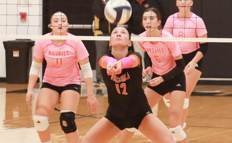 The intensity of last Tuesday night’s Polk County showdown between Osceola and Shelby-RC is written on the players faces. Osceola’s Alexis Burritt keeps the ball in play as Madison Augustin (11) Leah Whitmore (6) and Hayden Hopwood (8) are ready defensively. PCN photo by Ken Kush