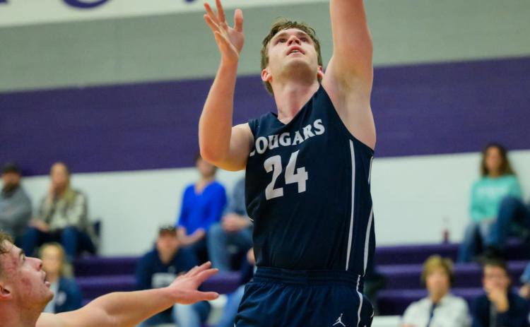 Langdon Arbuck goes up to score against Wood River. Photo courtesy of Jimmy Rash Photography.