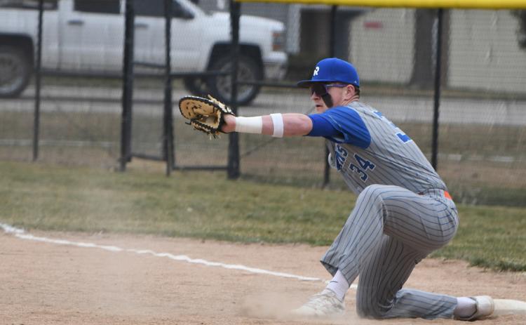 Kale Gustafson goes for the catch on first base. PCN photo by Rick Holtz.