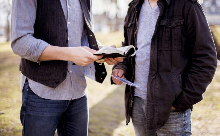 One person sharing God’s Word with another. Photo provided.