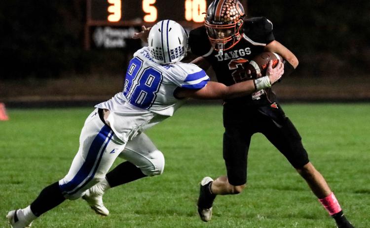 Jackson Winslow runs the ball against Archangels Catholic. PCN photo by Blaine Winslow.
