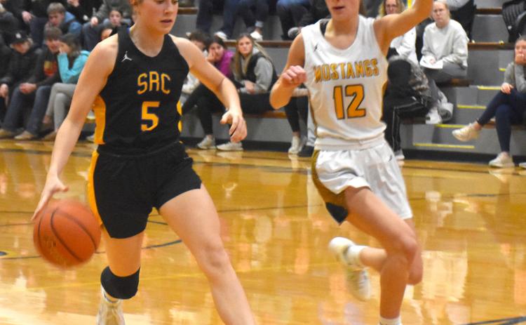 SRC junior Kaleigh Ruth (5) drives the ball towards the McCool Junction basket during last Thursday’s game against the Mustangs. PCN photo by Beth Sparrow.