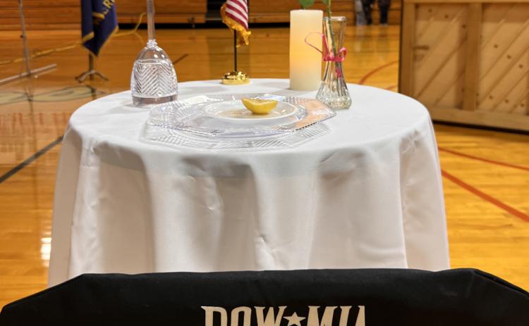 A POW/MIA Table was present at the Veterans Day Service held in the Osceola High School Gymnasium. The tradition has been seen in many Veterans Day programs across the country, and has existed since the end of the Vietnam War.