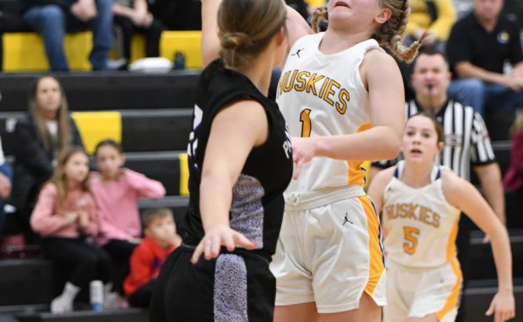 Taya Pinneo takes the ball up for a basket against a Fillmore Central defender in their tourney game Thursday. PCN photo by Rick Holtz.