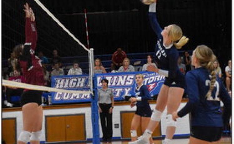 Bricelynn Larson gets the kill against Heartland earlier this season. PCN file photo by Beth Sparrow.