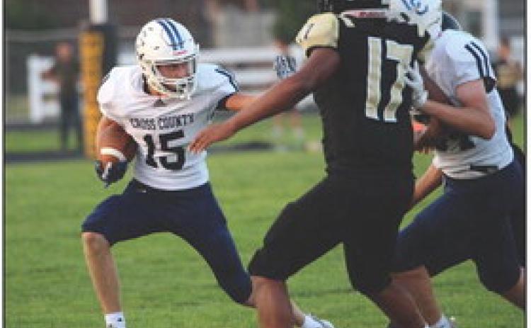 Above: Brayden Schmidtberger carries the football while getting away from McCool defenders. PCN photos by Travis Lane.