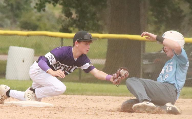 SOS Juniors second baseman Easton Cattau is unable to apply the tag at second base in time as the PWG base runner is able to slide to the inside of the second base bag. PCN photo by Ken Kush.