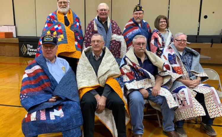 Quilts of Valor recipients: Back row: Scott Anderson, Sherman Wilshusen, Doug Jones, Pat Pedersen. Front row: Richard Kropatsch, James Varney, Gregory Heindreyx, Allen Pedersen. Photo provided