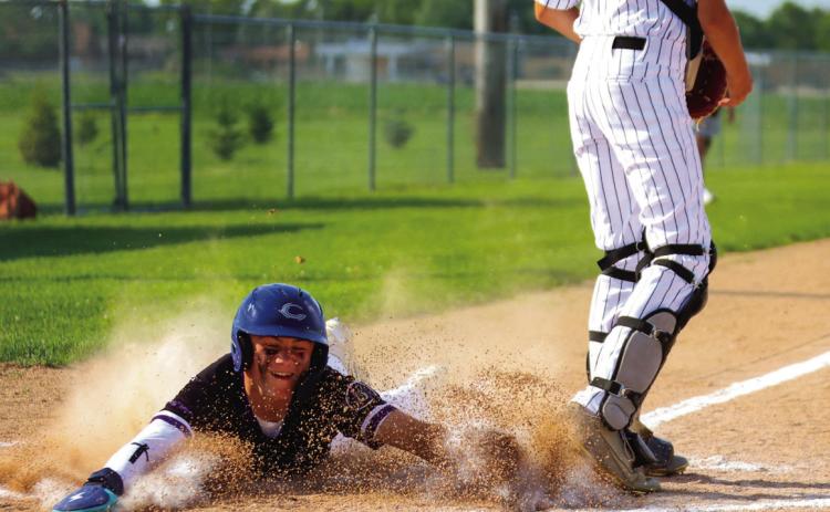 SOS Rebel Senior slides head first into home scoring the first of his two runs in Thursday night’s game with Albion in Osceola. PCN photo by Blaine Winslow.