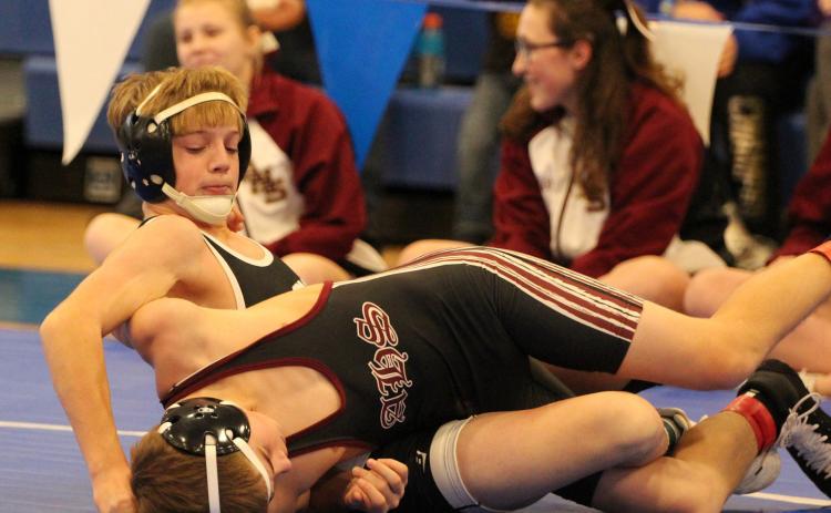 Devin Nuttelman is twisted up trying to pin his opponent. PCN photo by Travis Lane