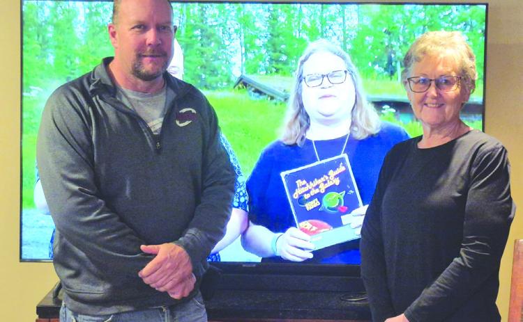 NNTC technician Brian Eberle and one year fiber internet winner Clare Quandt are pictured after her internet was installed. Photo provided.