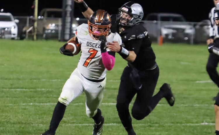 Osceola Bulldog’s senior running back Aden Feezell (7) carries the ball down inside the Raiders 15-yard line in second quarter action on Thursday night in Lawrence. Feezell scored the Bulldogs only first half TD as time expired in the second quarter. PCN photo by Ken Kush.