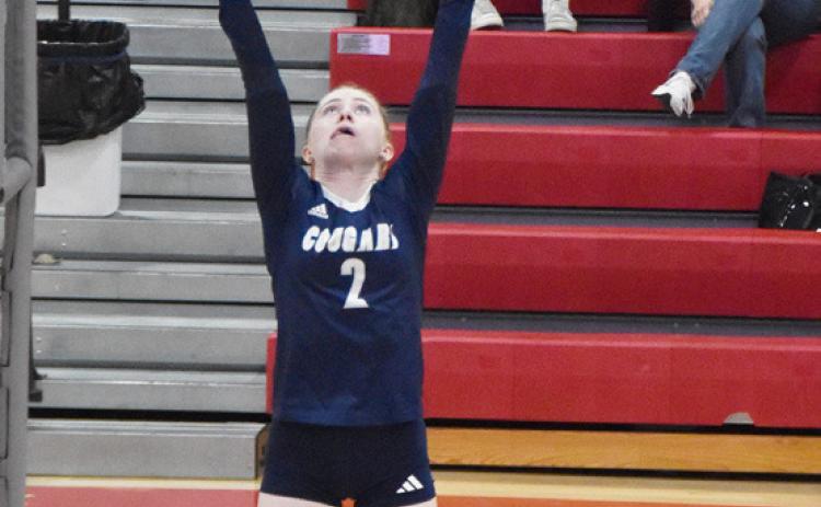 Left- Cross County sophomore Piyper Berggren (2) sets up the Cougars front line. Right- Senior Saphira Osentowski is on the attack against the H &amp; H defense. PCN photos by Beth Sparrow.