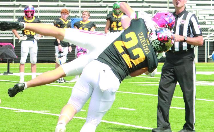Shelby-RC’s Coy Vrbka, a captain on the East team, sacks West quarterback Gage Hedstrom in the second quarter of Saturday’s game in Hastings. PCN photo by Ken Kush.