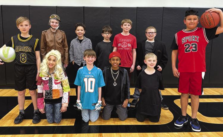Back Row (left): Dawson Baloun (Kobe Bryant), Monica Ray (Amelia Earhart), Will Peterson (Ben Stiller), Scott Williams (Steve Jobs), Mason Alexander (Patrick Mahomes), Layton Burritt (Ole Kirk Christiansen), Keagan Alexander (Michael Jordan). Front Row: Elayna Brown (Dolly Parton), Emmett Drozd (Tyreek Hill), Jeremy Battle (Dion Sanders), Milo Vaughn (Michael Jackson). PCN photos by Rick Holtz