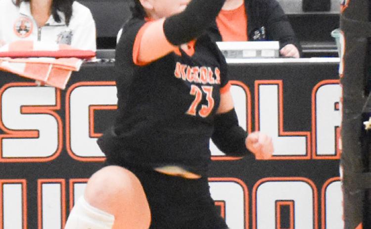 Left- Osceola senior Bella Recker led the Bulldogs past the East Butler Tigers on Monday night with 18 kills in their 3-0 sweep to advance to the finals of the D1-4 subdistrict tournament at Osceola. Right- Cross County senior Cortina Donnelly had six kills, one block and two ace serves as the Cougars saw their season come to an end losing in three straight sets to Aquinas. PCN photos by Beth Sparrow.