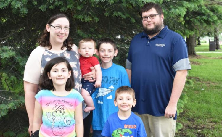 Rick Holtz recently joined the Polk County News staff. He is joined by wife, Kimberly, Calvin, 11, Penny, 7, Charlie, 4, and Timothy, 8 months.