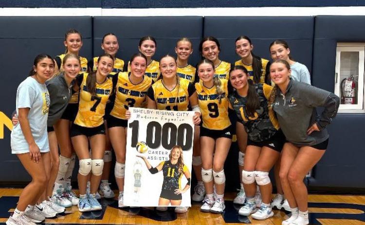 Pictured here with her team, junior Madison Augustin celebrates her 1,000th career set assists at Raymond Central High School. Photos provided