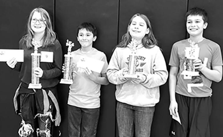 Winners of the 5th and 6th grade spelling bee are (first) Lily Crane of Osceola, (second) Dominic Georges of Cross County, (third) Bradley Lott of Cross County, and (fourth) Derek Georges of Cross County.