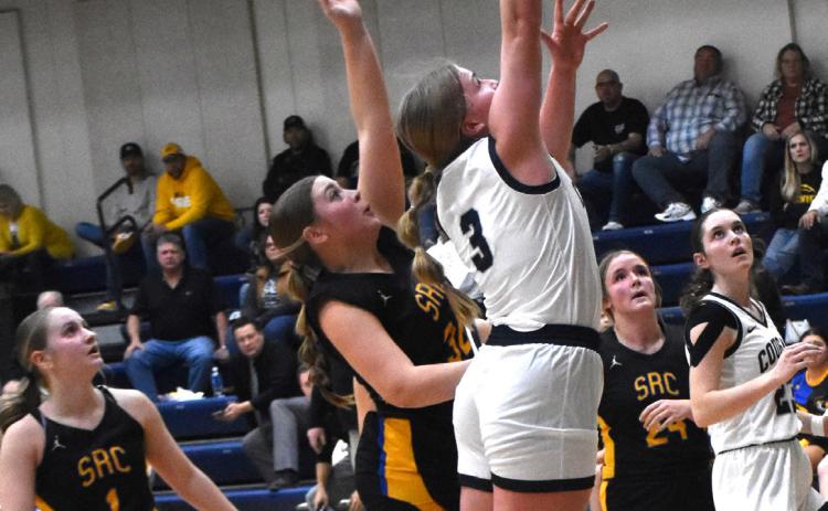 Ema Dickey (CC) goes up against Jordyn Donner (SRC) for a rebound. PCN photo by Beth Sparrow.
