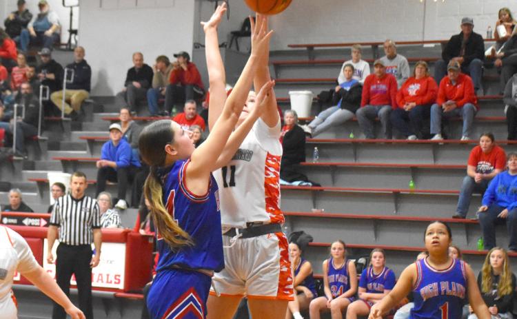 High Plains freshman Brooklyn Welch (14) puts up the shot against the Giltner/Harvard defender during Friday night’s game in Harvard. PCN photo by Beth Sparrow.