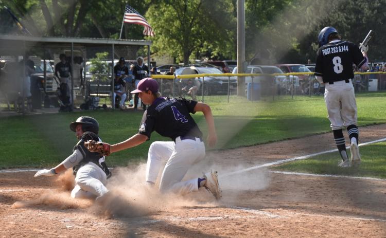 Isaac Whitmore tags a Twin River Titan out in a previous game this season. PCN photo by Beth Sparrow.