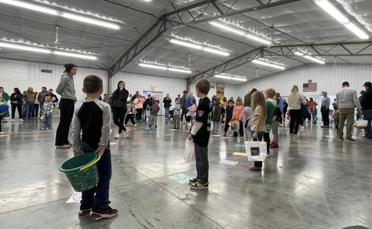 Due to the wet and cold conditions outdoors, the annual Osceola Easter Egg Hunt last Wednesday was moved indoors to the Polk County Fairgrounds. Photos were provided.