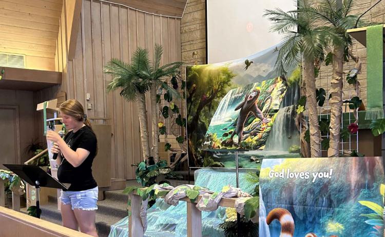 Vacation Bible School in Osceola was last week at St. Paul Lutheran. Above: Miranda Ericson leads the kids. Below: Kids are excited to learn about God. Photos provided.