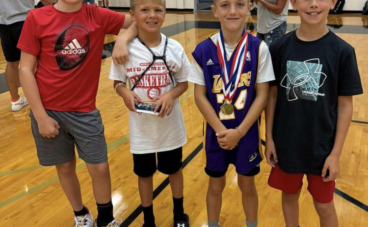 Pictured are Miles Webster, Ryvr Goodenkauf, Jeter Zelasney and Declan Gabel. The boys went to Mike Traders Mid-America Basketball camp. Jeter and Declan received the hustle award, which is only given to one kid in each division. Photo provided.