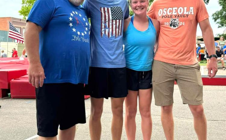 Kelby Neujahr and Janna Roberts participated in Aurora’s street vault. Kelby set a new personal best at 13 feet. Pictured are Coach Jeff Wilson, Kelby Neujahr, Janna Roberts and Coach Luke Ericson. Photo provided.