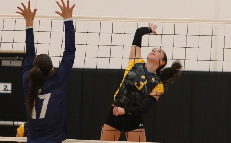 Top-Shelby-RC senior Kaleigh Ruth (3) hammers one of her 23 kills in the Huskies 3-1 win over Cross County last Thursday.