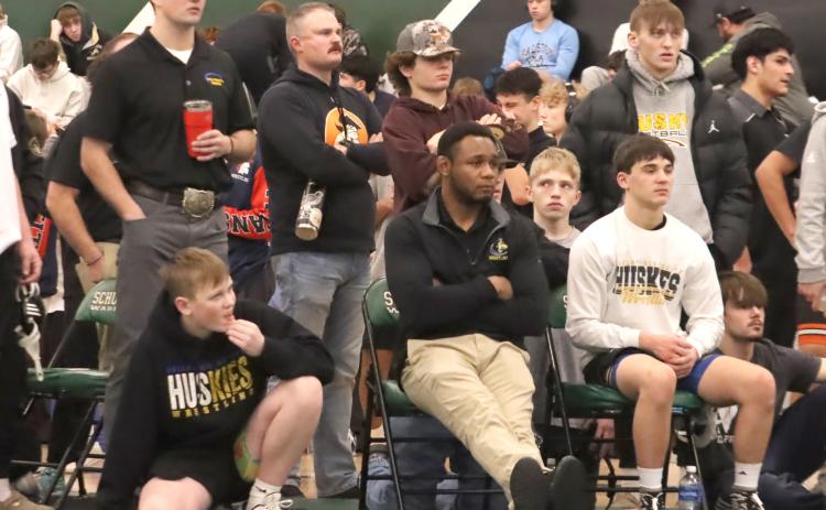SRC Boys Wrestling- The 2025-2026 wrestling season is winding down. Here the team and coaches watch during a match at Saturday’s Schuyler Invite. PCN photo by ken Kush.