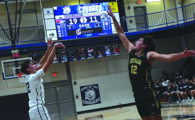 Senior Thatcher Hanson shoots a three pointer against Central City. PCN photo by Beth Sparrow.