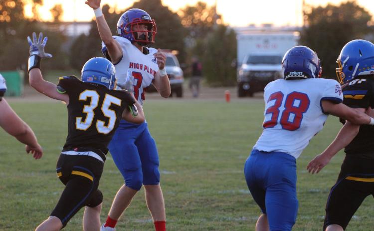 Brodey Spurling throws a pass as Camden Morris blocks. PCN photo by Travis Lane.