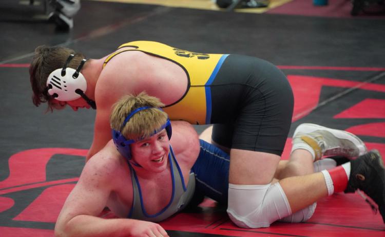 Collin Vrbka rolls over his opponent on his way to being crowned champion at David City. PCN photo by Jen Vrbka