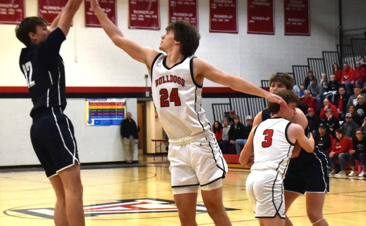 Ashton Seim goes for the trey against Auburn on Saturday. PCN photo by Beth Sparrow.