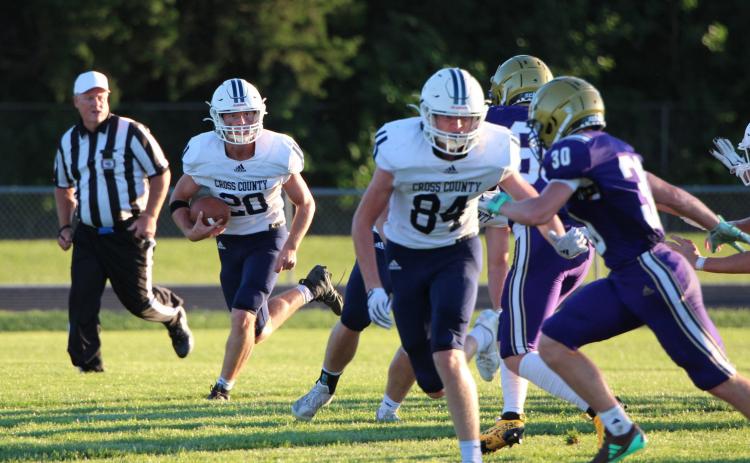 Langdon Arbuck and Wyatt Hengelfelt block for Carson Schaefer to run the ball. PCN photo by Travis Lane.