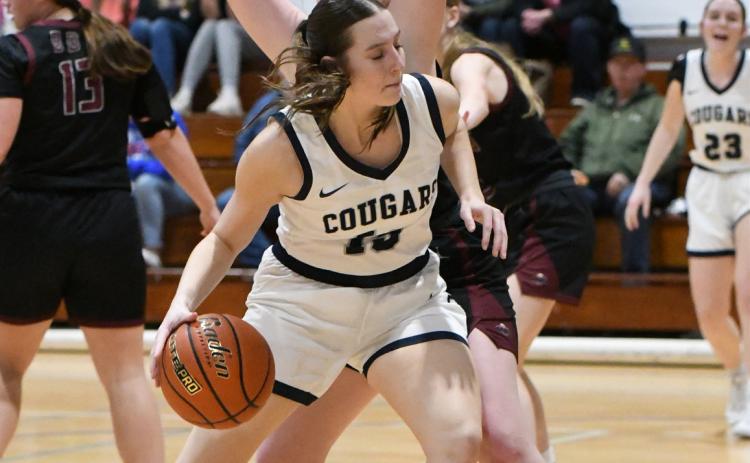 Adrienne Waller dribbles around a BDS opponent to get to the basket. PCN photo by Rick Holtz.