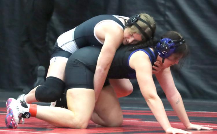 Cross County/Osceola’s Ema Dickey is in control here, but Blue River’s Jessica Bauers would pick up the win in the matchup at 170 pounds. Bauers took second and Dickey was third. PCN photo by Ken Kush